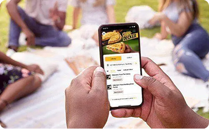 Hands holding phone with online ordering app