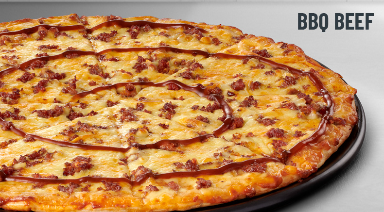 BBQ beef pizza on a black plate