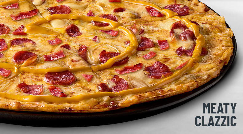 Meaty Clazzic Halaal Pizza on a black plate