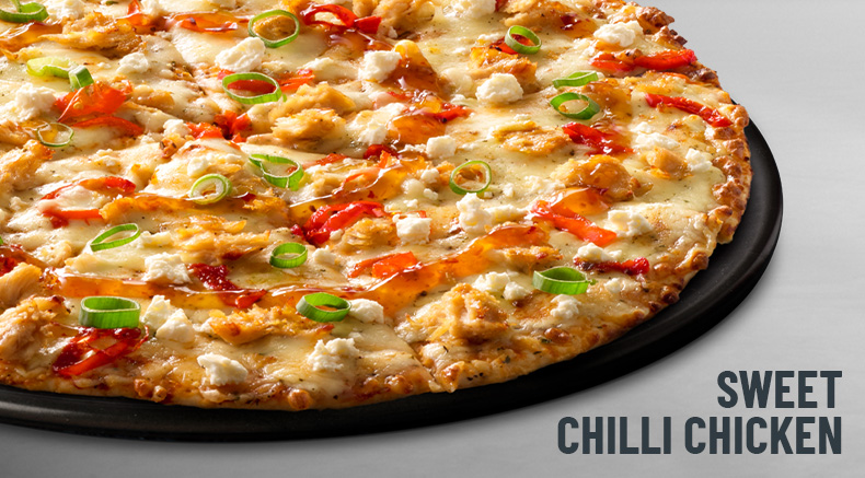 Sweet Chilli Chicken Pizza on a black plate