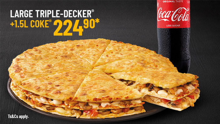 Large Triple-Decker pizza with layered cheese, mushrooms, and toppings alongside a 1.5-liter Coca-Cola bottle.